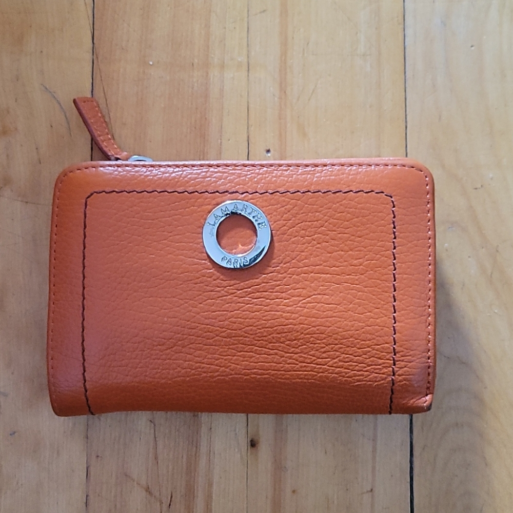 Didier Lamarthe compact wallet in orange leather.